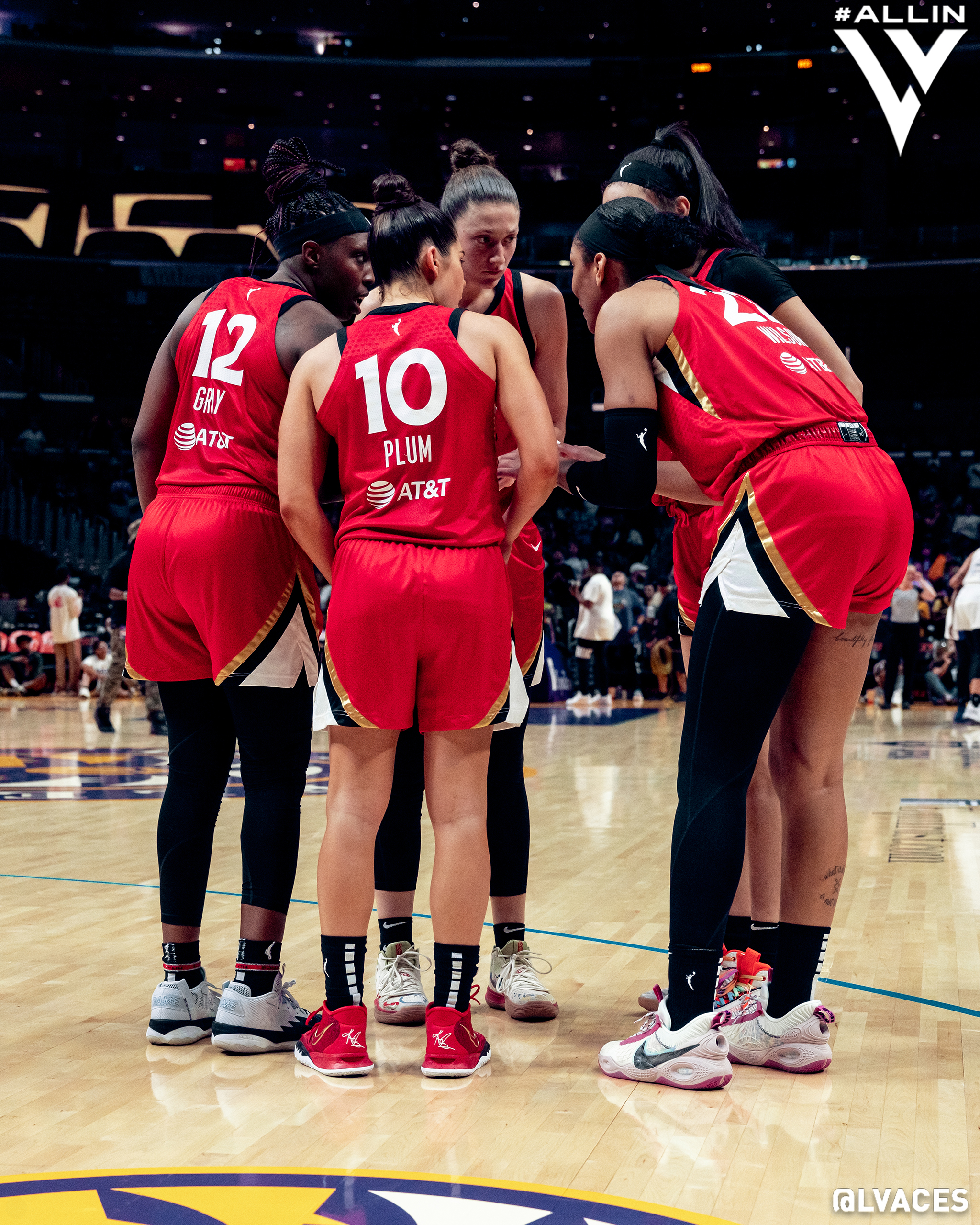 WNBA players huddle